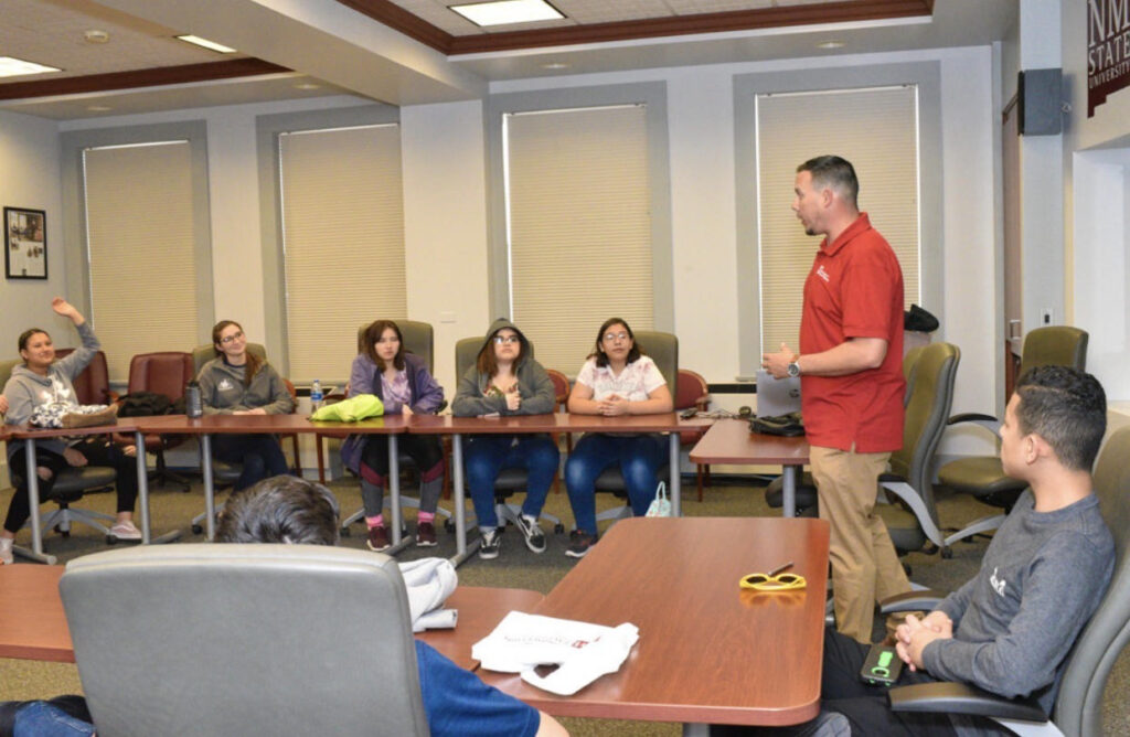 David P. Acosta presenting in front of students