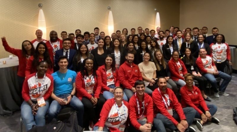 Group of people posing in red clothing