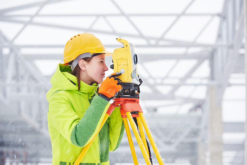 photo of a female surveyor on the job